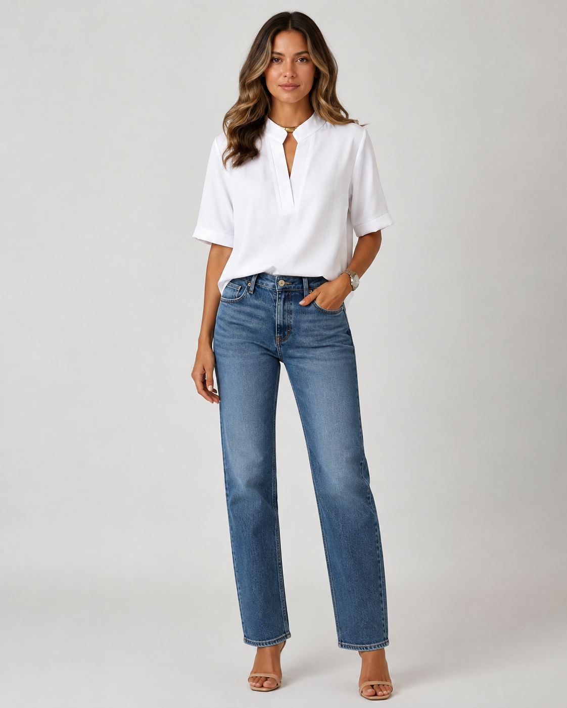 Elegant blouse with V‑neck and gold‑toned details