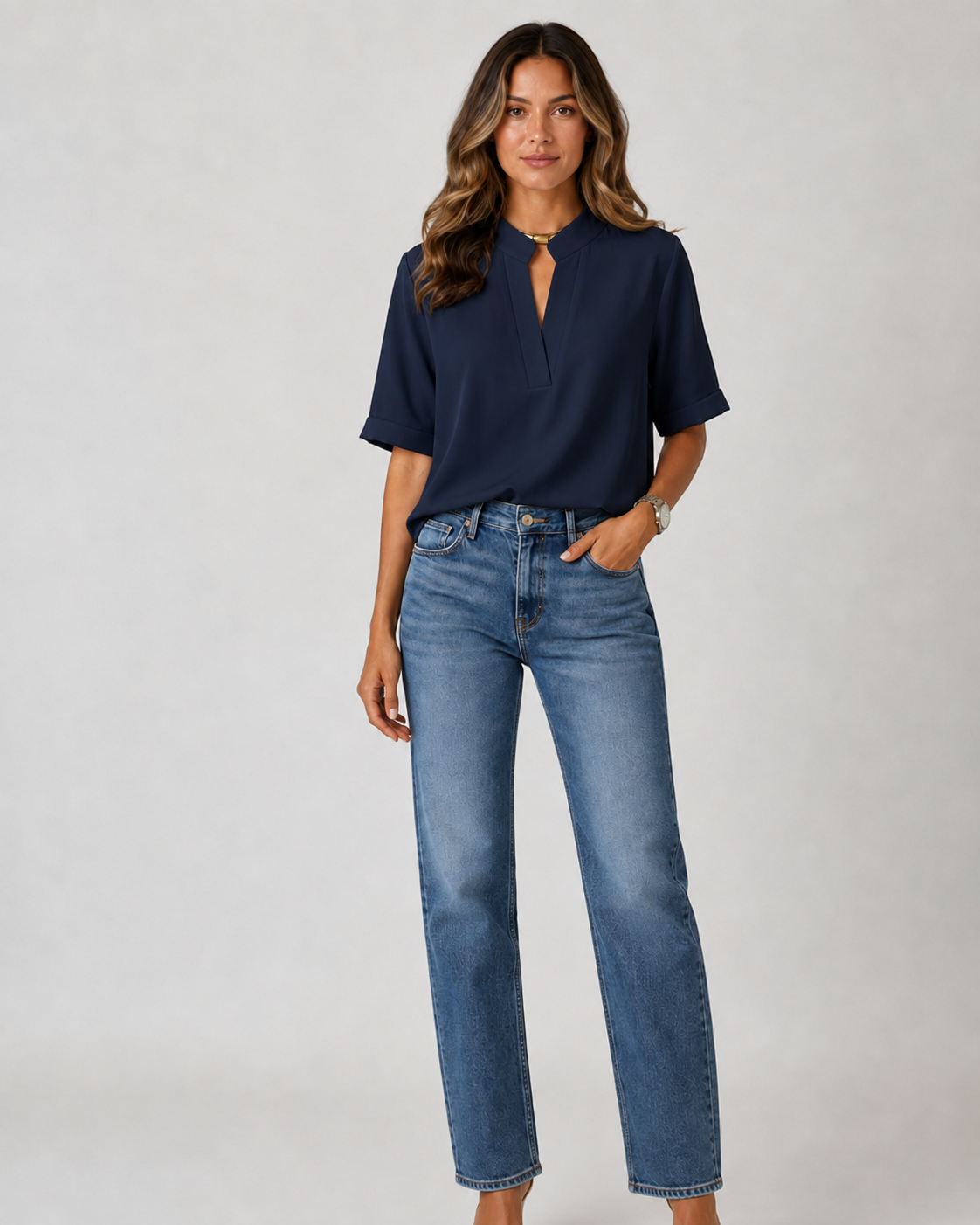 Elegant blouse with V‑neck and gold‑toned details