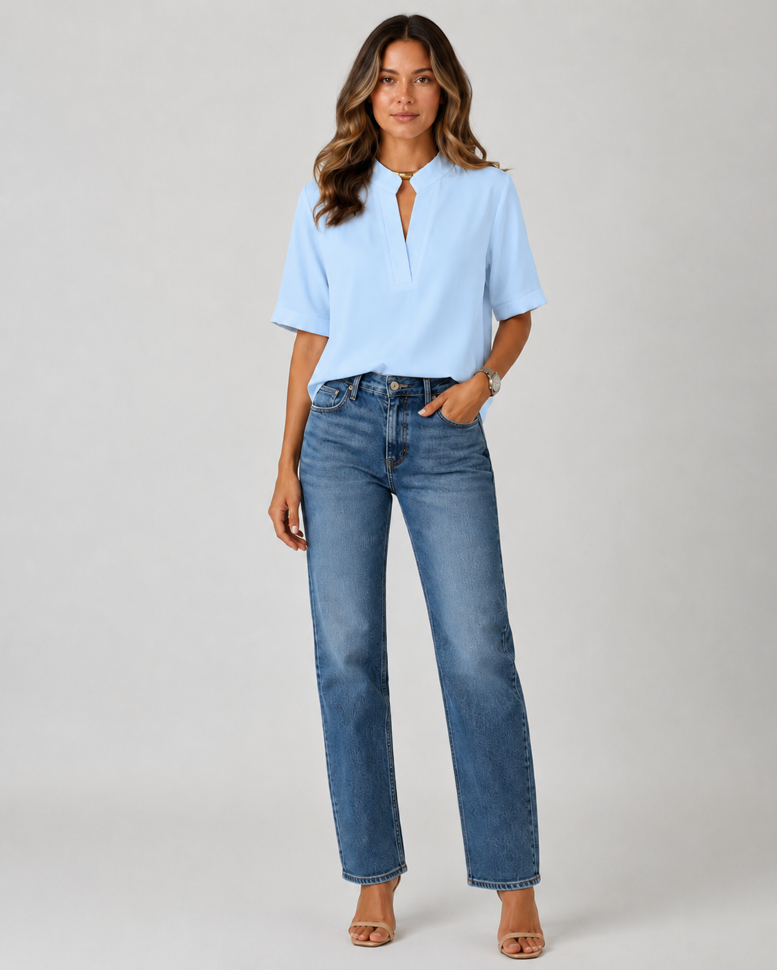 Elegant blouse with V‑neck and gold‑toned details