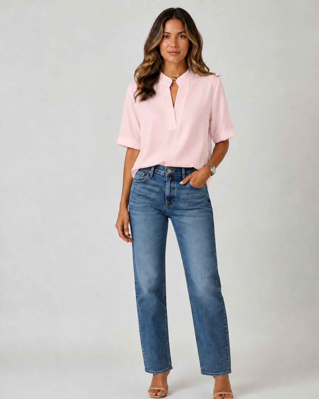 Elegant blouse with V‑neck and gold‑toned details